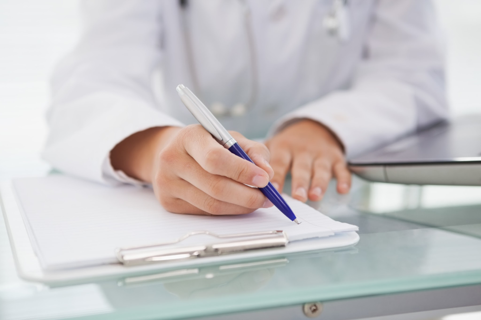 Medical staff writing notes